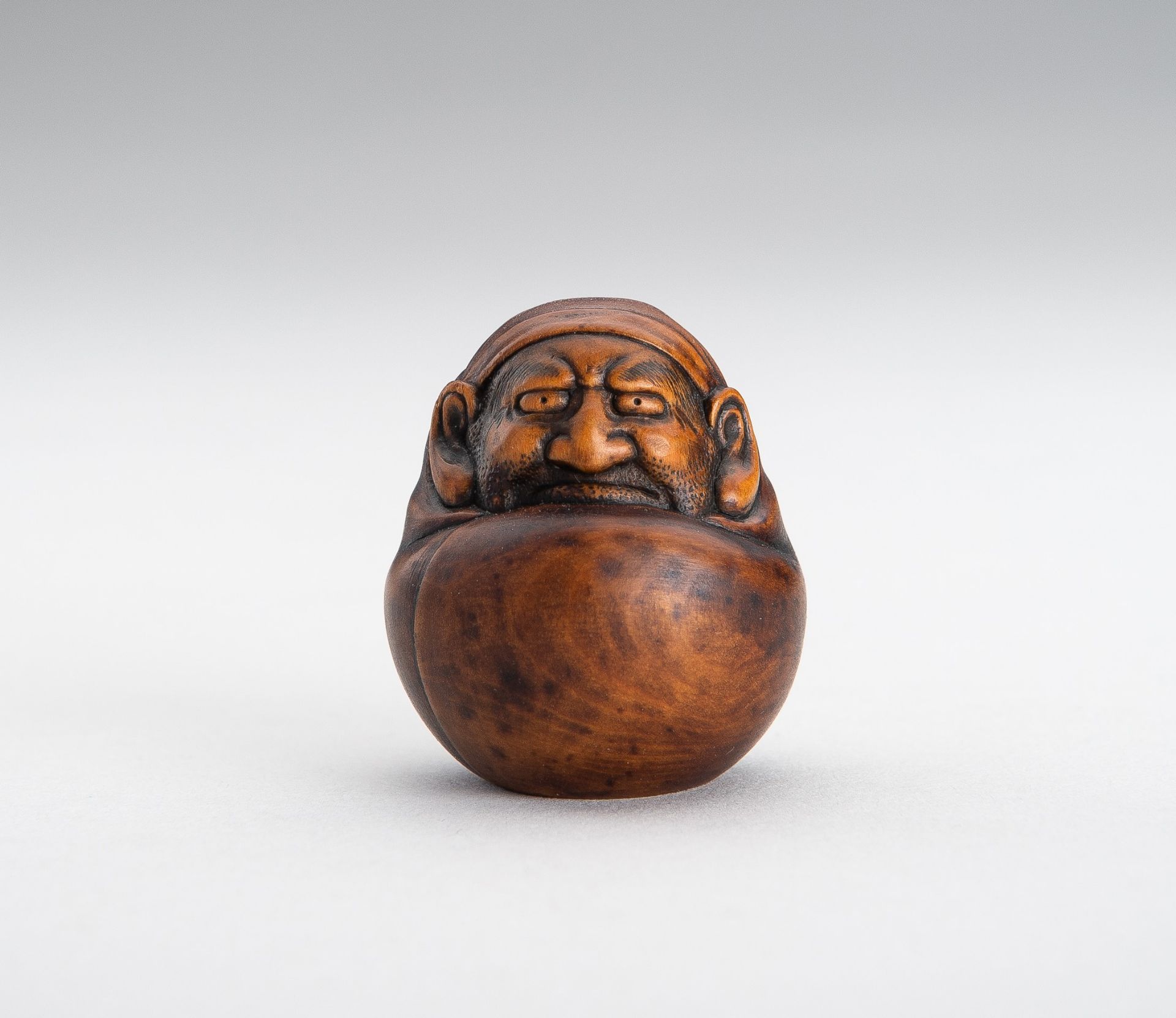 MASANAO: A WOOD NESTUKE OF A DARUMA DOLL