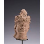 A SMALL TERRACOTTA HEAD OF MAITREYA, GANDHARA