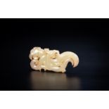 A PALE GREEN JADE CARVING WITH DRAGON AND PHOENIX, BEISHANTOU TYPE, WESTERN HAN