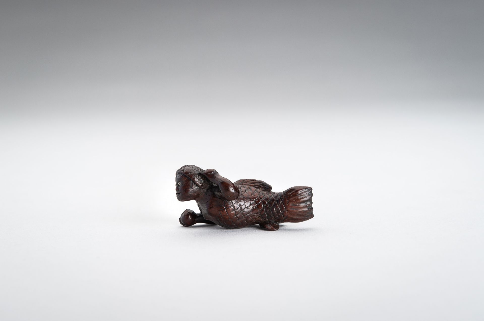 A WOOD NETSUKE OF A SWIMMING NINGYO (MERMAID) - Image 2 of 10