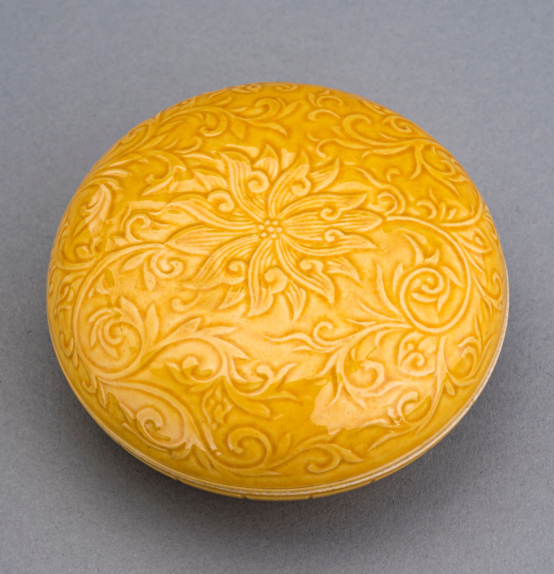 A YELLOW GLAZED PORCELAIN BOX AND COVER, c. 1920s