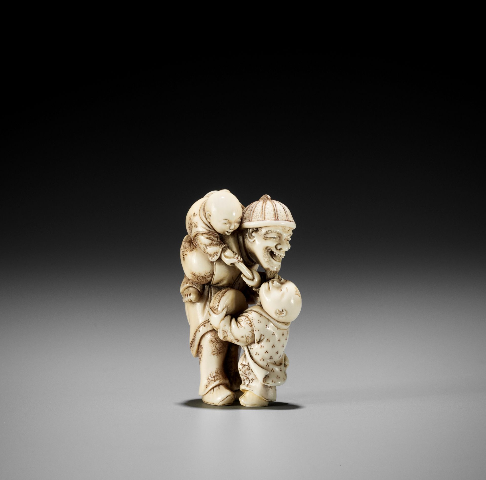 HIDEMASA: AN IVORY NETSUKE OF A DUTCHMAN WITH CHILDREN