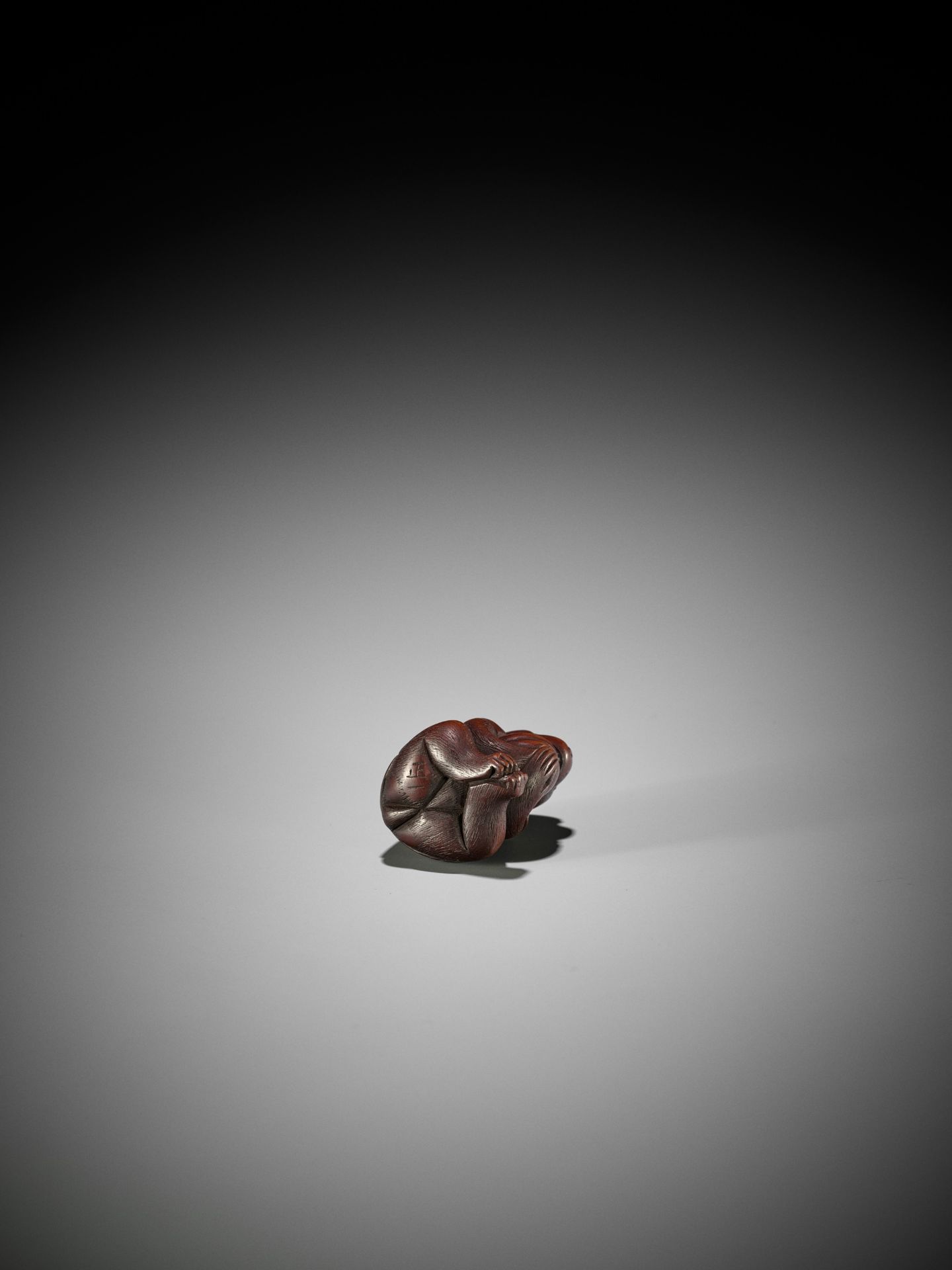 MASAKAZU: A WOOD NETSUKE OF A MONKEY WITH PEACH, SCHOOL OF TOMOKAZU - Image 9 of 10