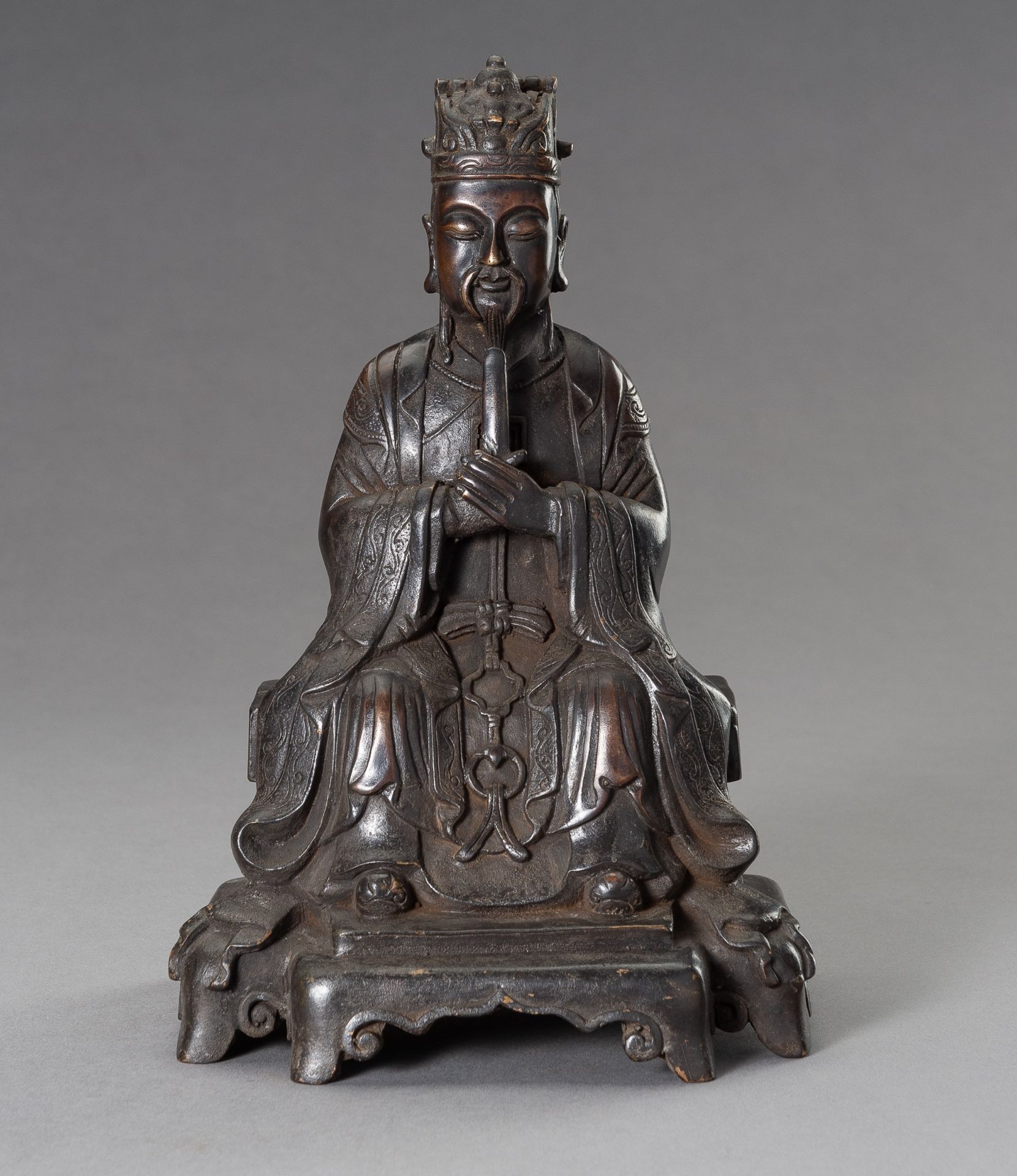 A MING-STYLE BRONZE FIGURE OF A DIGNITARY