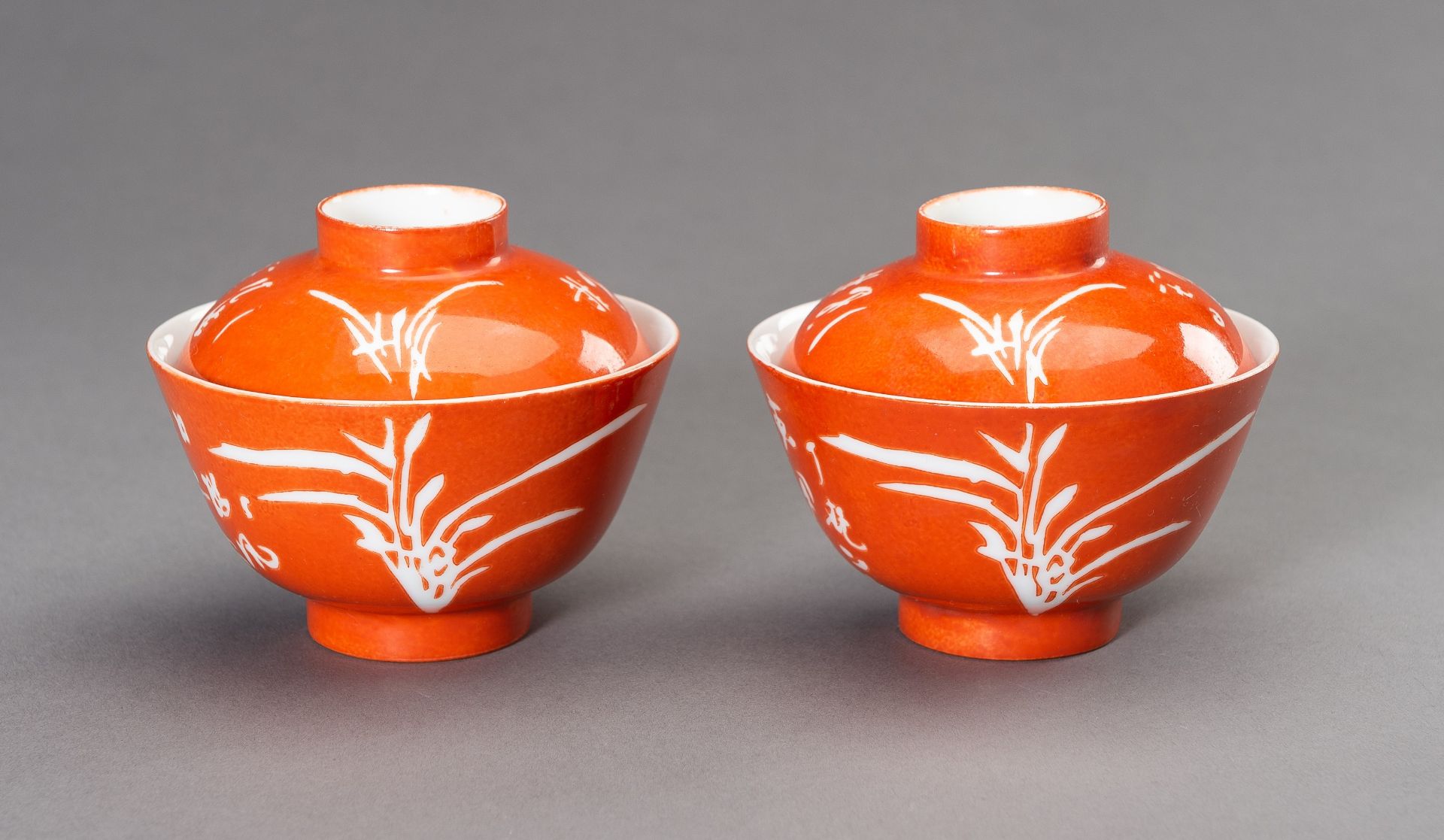 A PAIR OF CORAL RED BOWLS AND COVERS, REPUBLIC PERIOD