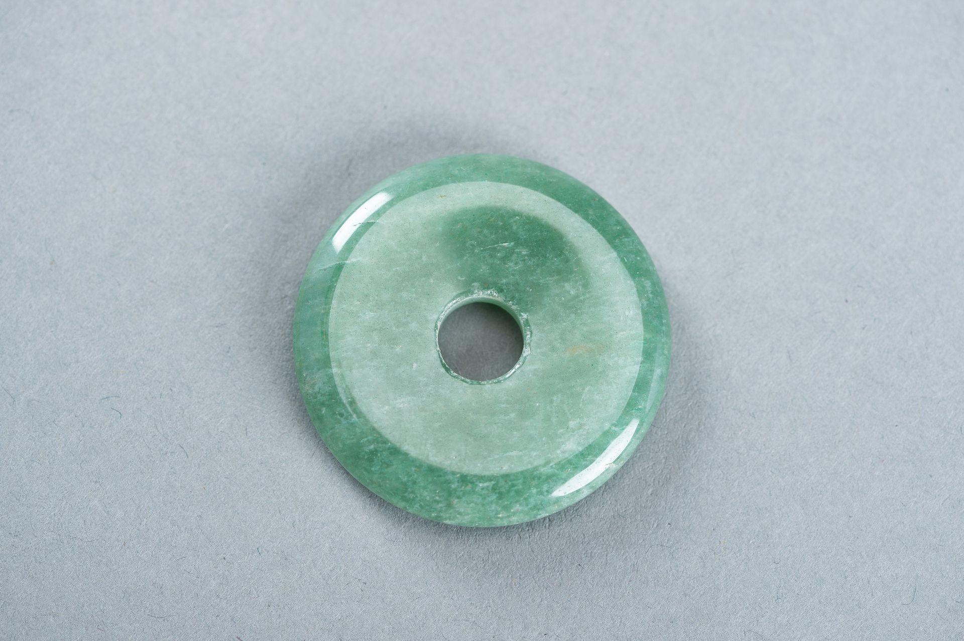 A GROUP OF FOUR JADEITE DISC PENDANTS - Image 3 of 10