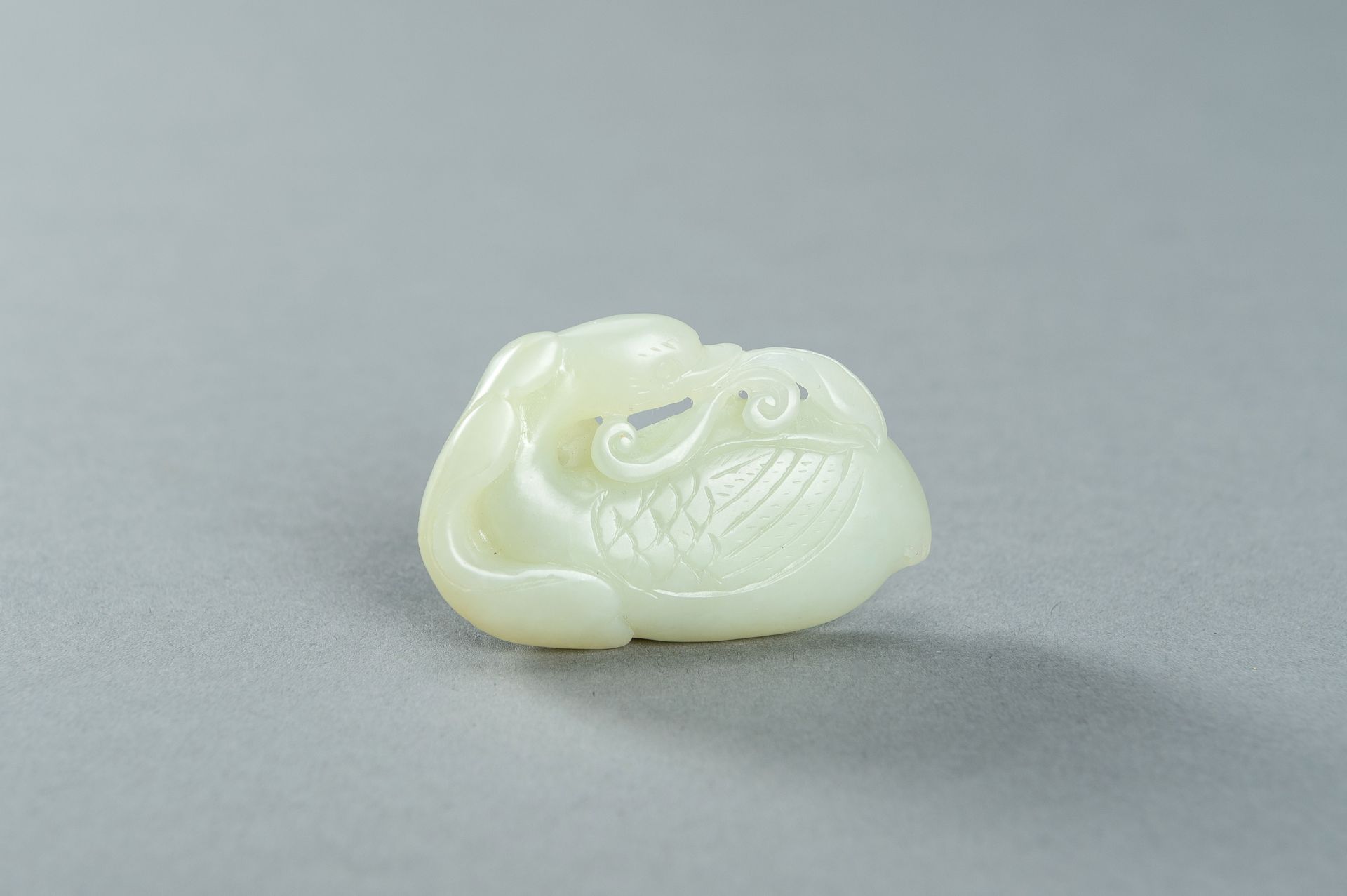 A PALE CELADON JADE CARVING OF A DUCK, 1900s - Image 3 of 13