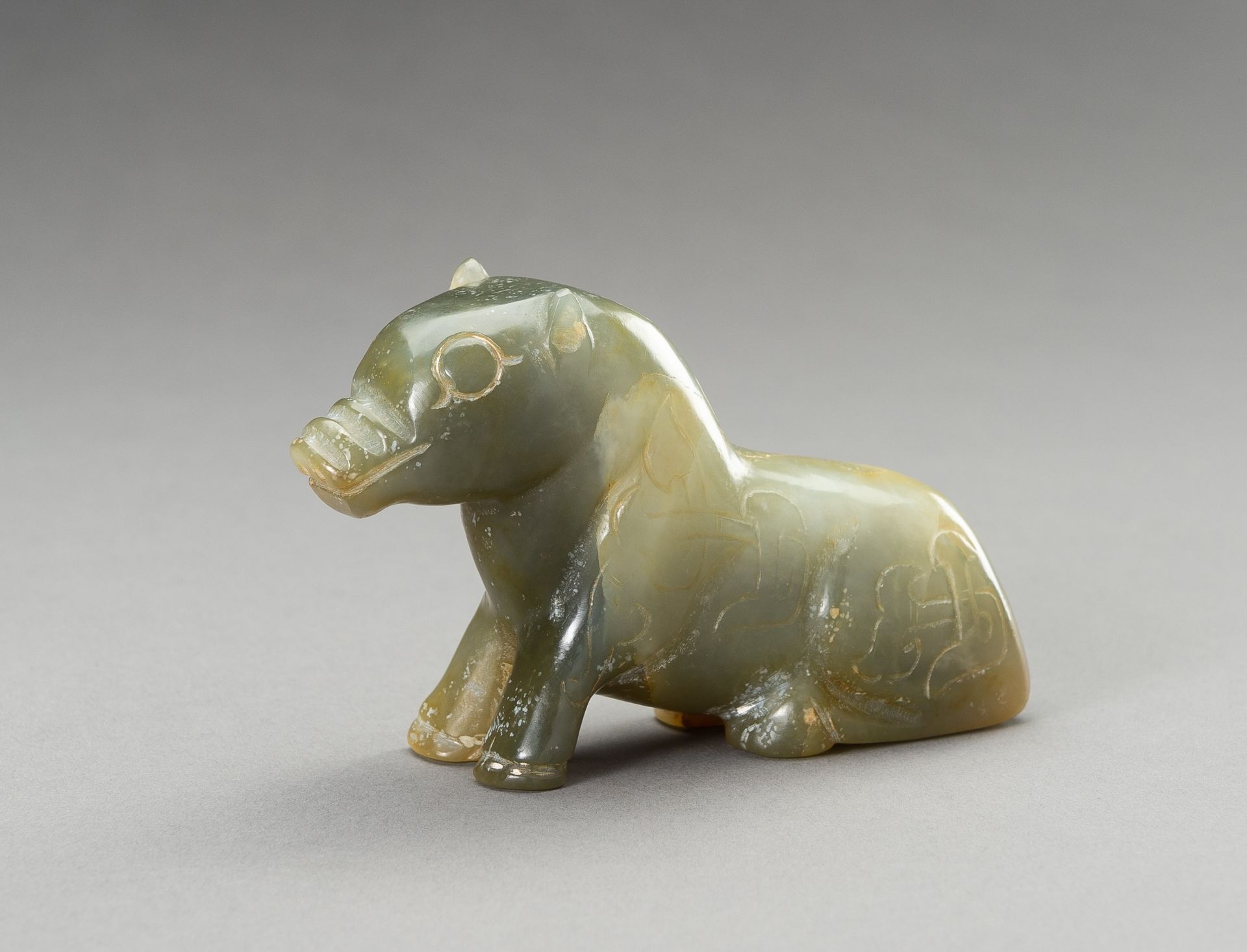 AN ARCHAISTIC SEA-GREEN HARDSTONE FIGURE OF A BEAST, 20TH CENTURY