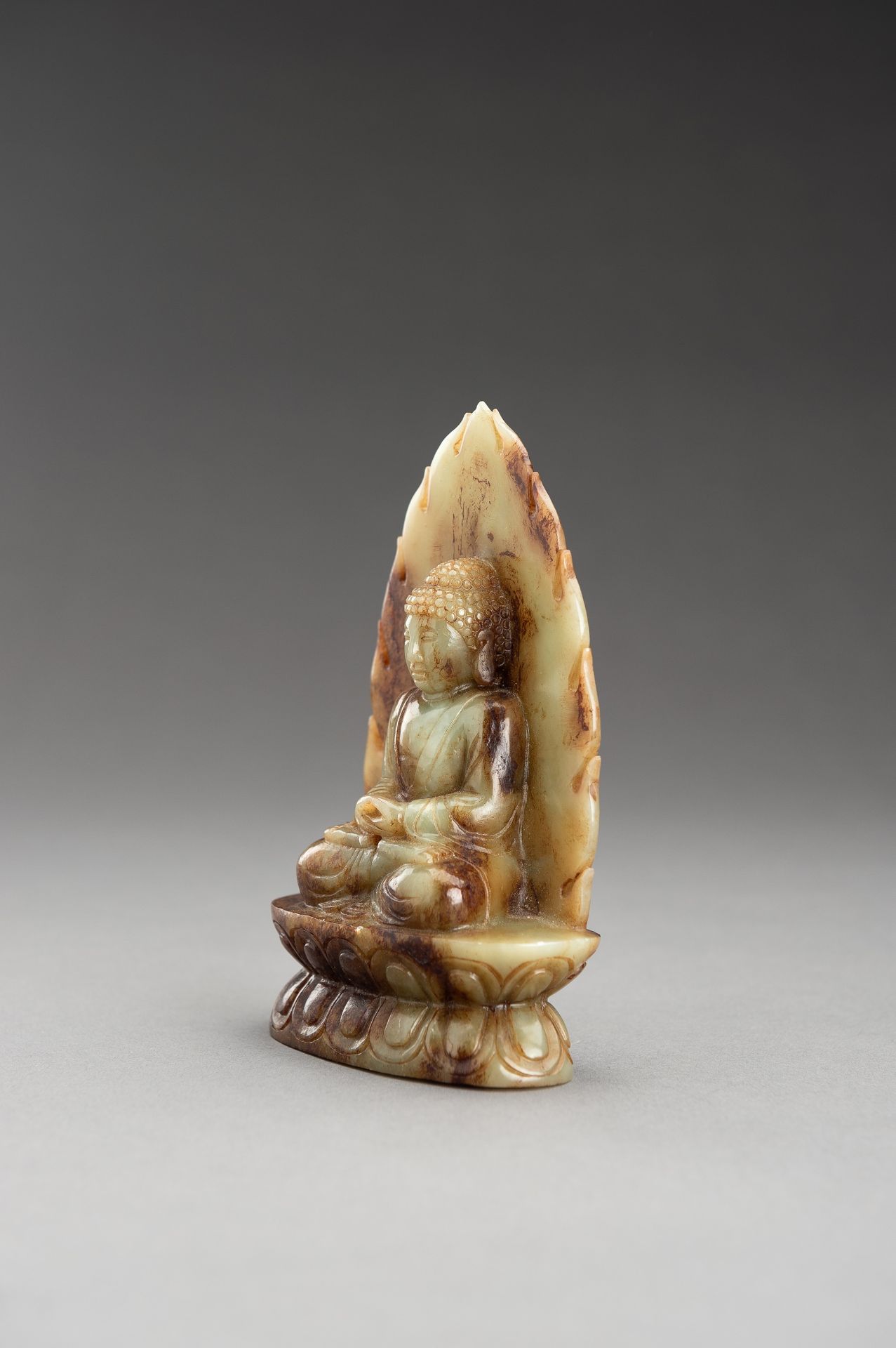 A PALE CELADON AND RUSSET JADE FIGURE OF BUDDHA - Image 3 of 10