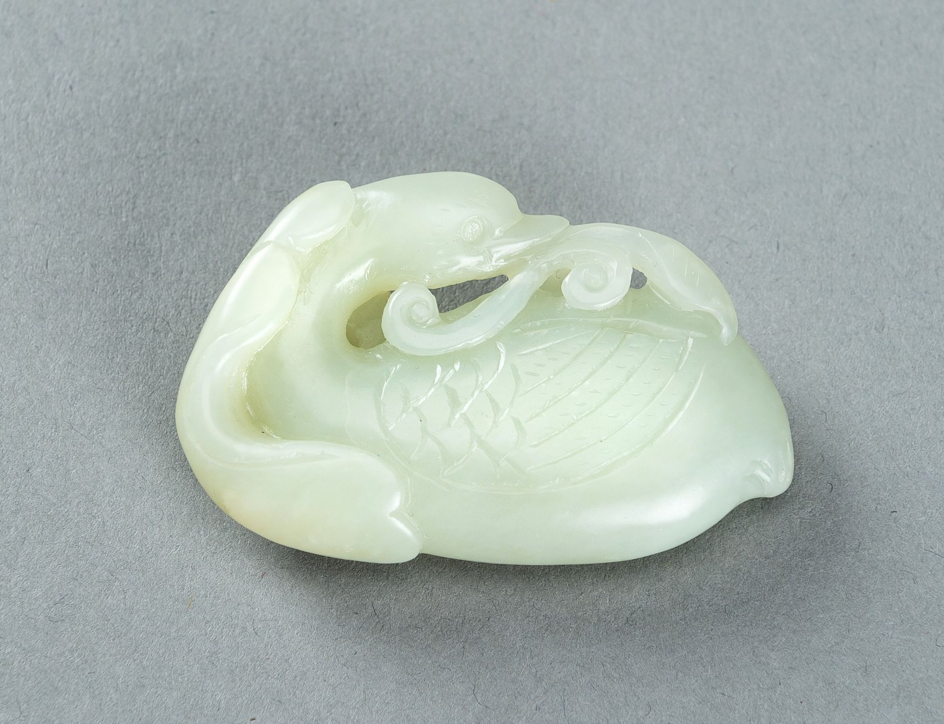 A PALE CELADON JADE CARVING OF A DUCK, 1900s