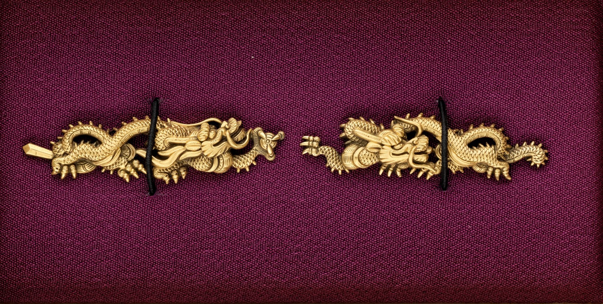 A PAIR OF GILT SILVER GOTO SCHOOL DRAGON MENUKI