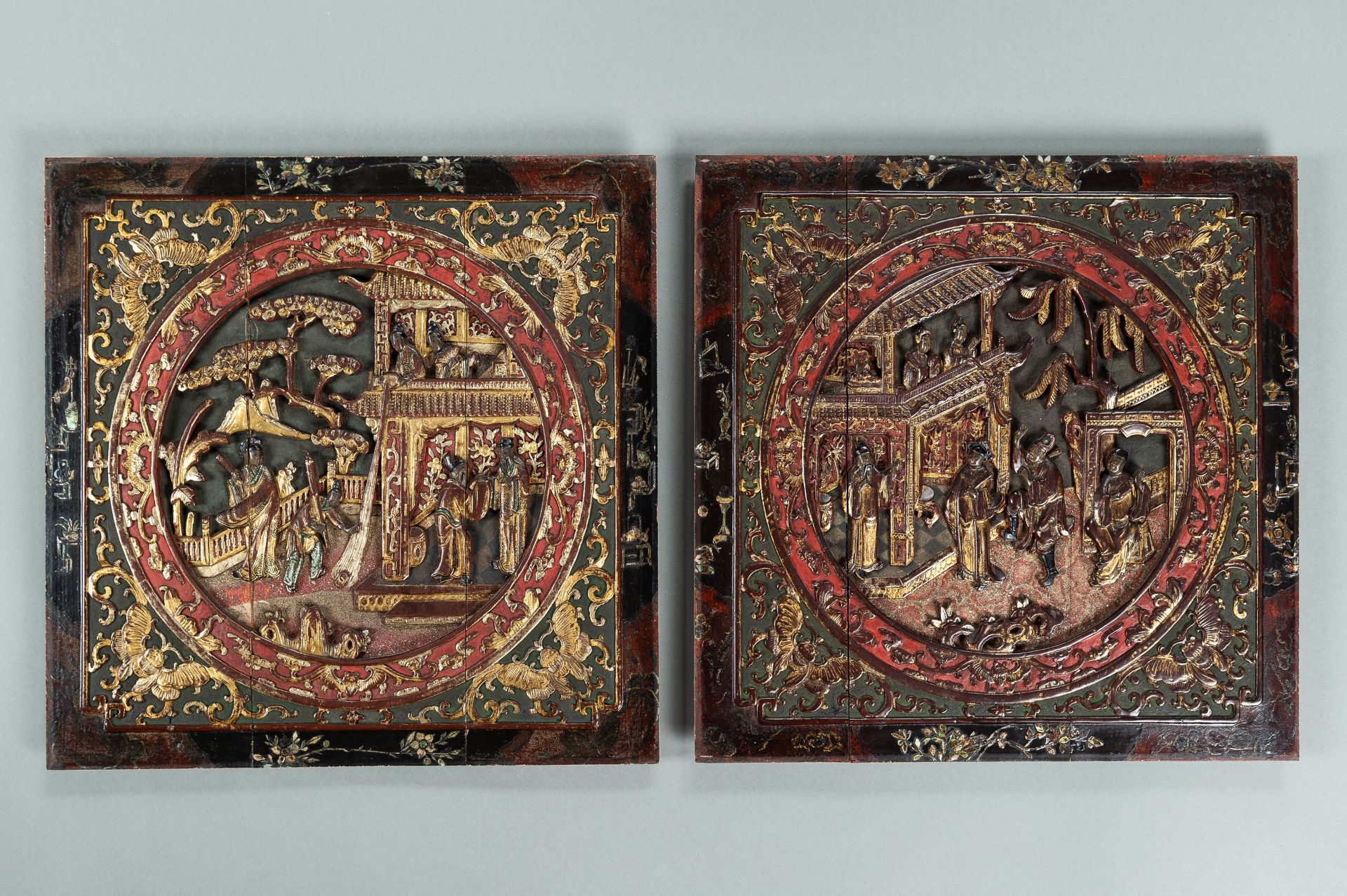 A PAIR OF LACQUERED WOOD PLAQUES