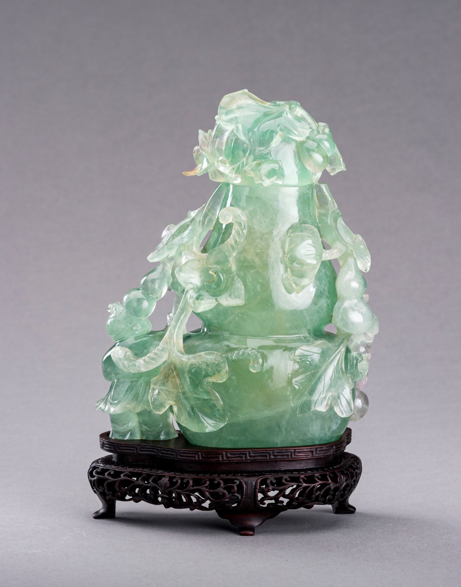 A GREEN FLUORITE 'DOUBLE GOURD AND BOY' VASE