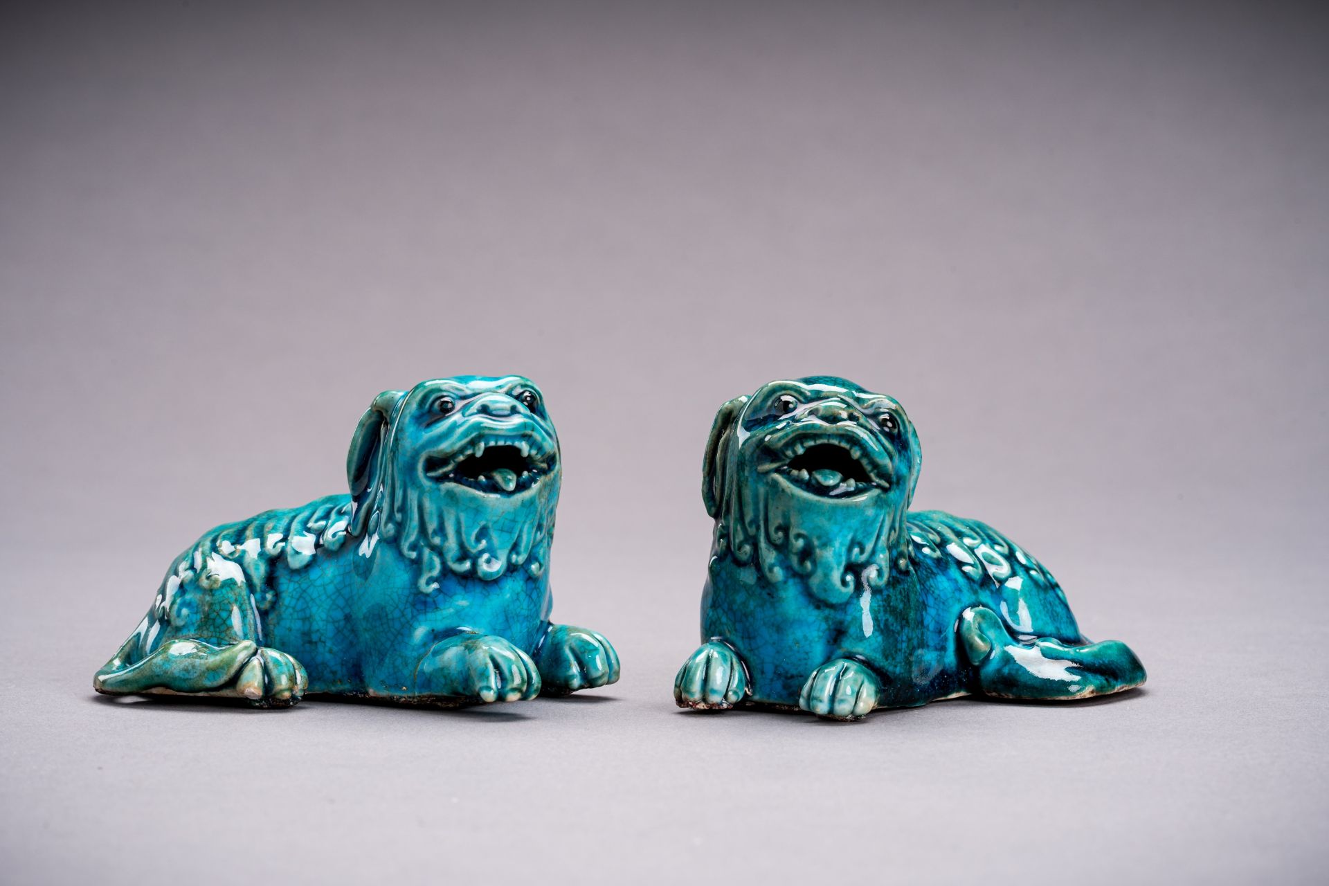 A PAIR OF TURQUOISE GLAZED PORCELAIN BUDDHIST LIONS, QING - Image 2 of 6