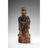 A LACQUERED WOOD FIGURE OF A DIGNITARY, EARLY QING