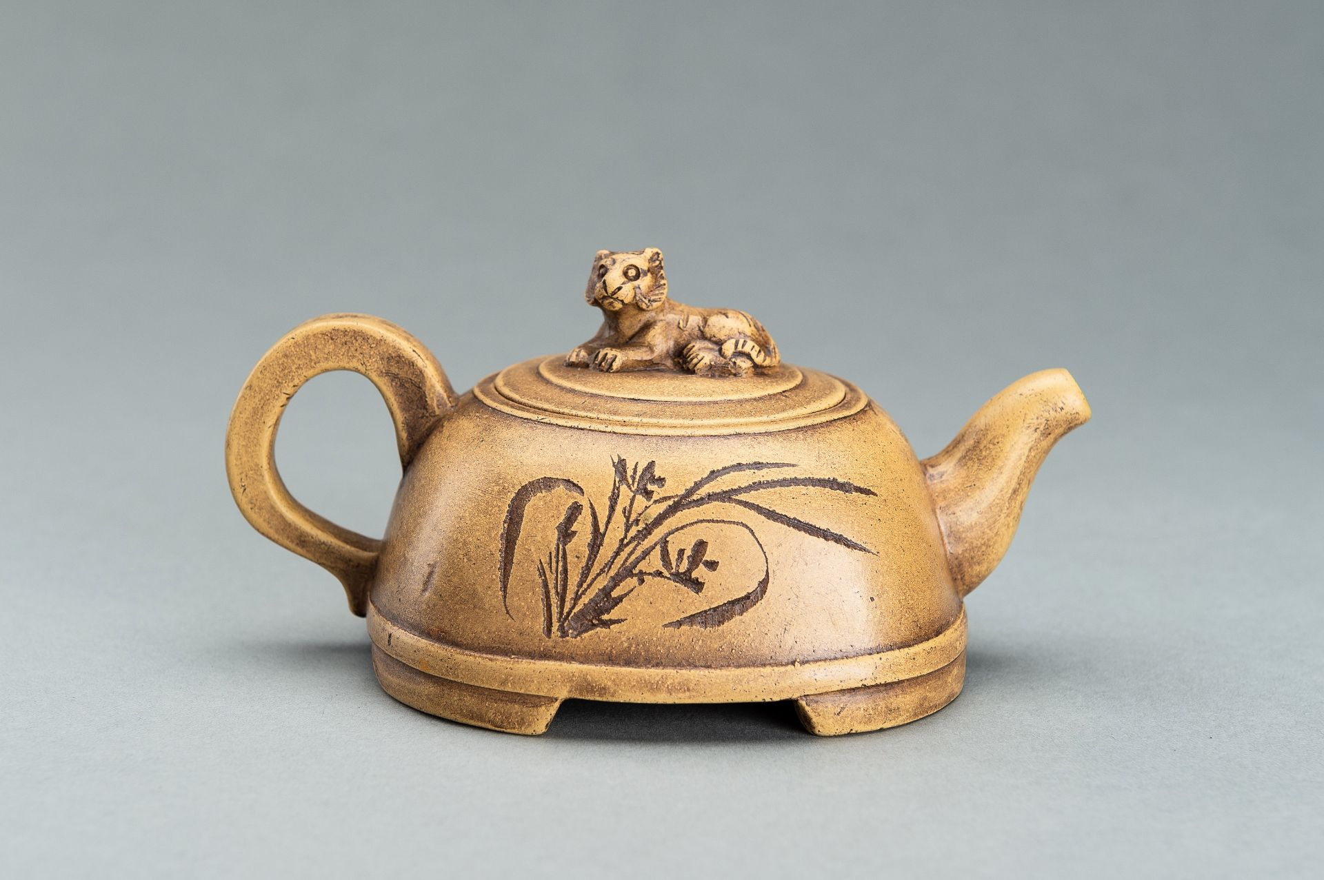 AN YIXING TEAPOT WITH FLOWERS