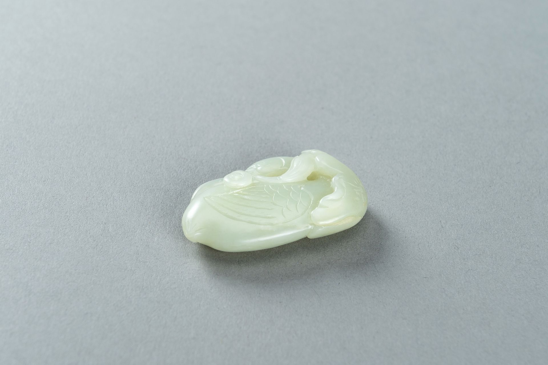 A PALE CELADON JADE CARVING OF A DUCK, 1900s - Image 13 of 13