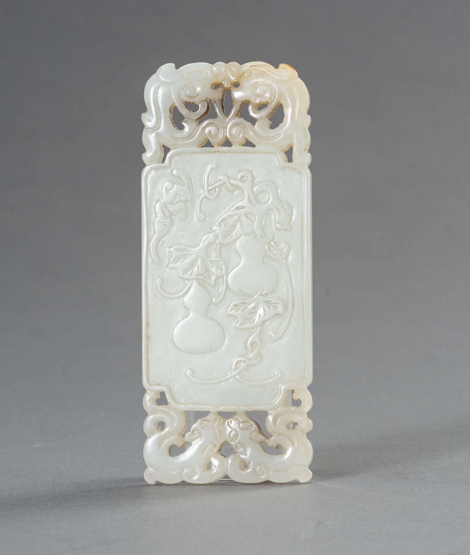 A WHITE JADE 'DOUBLE GOURD' PLAQUE, 1930s