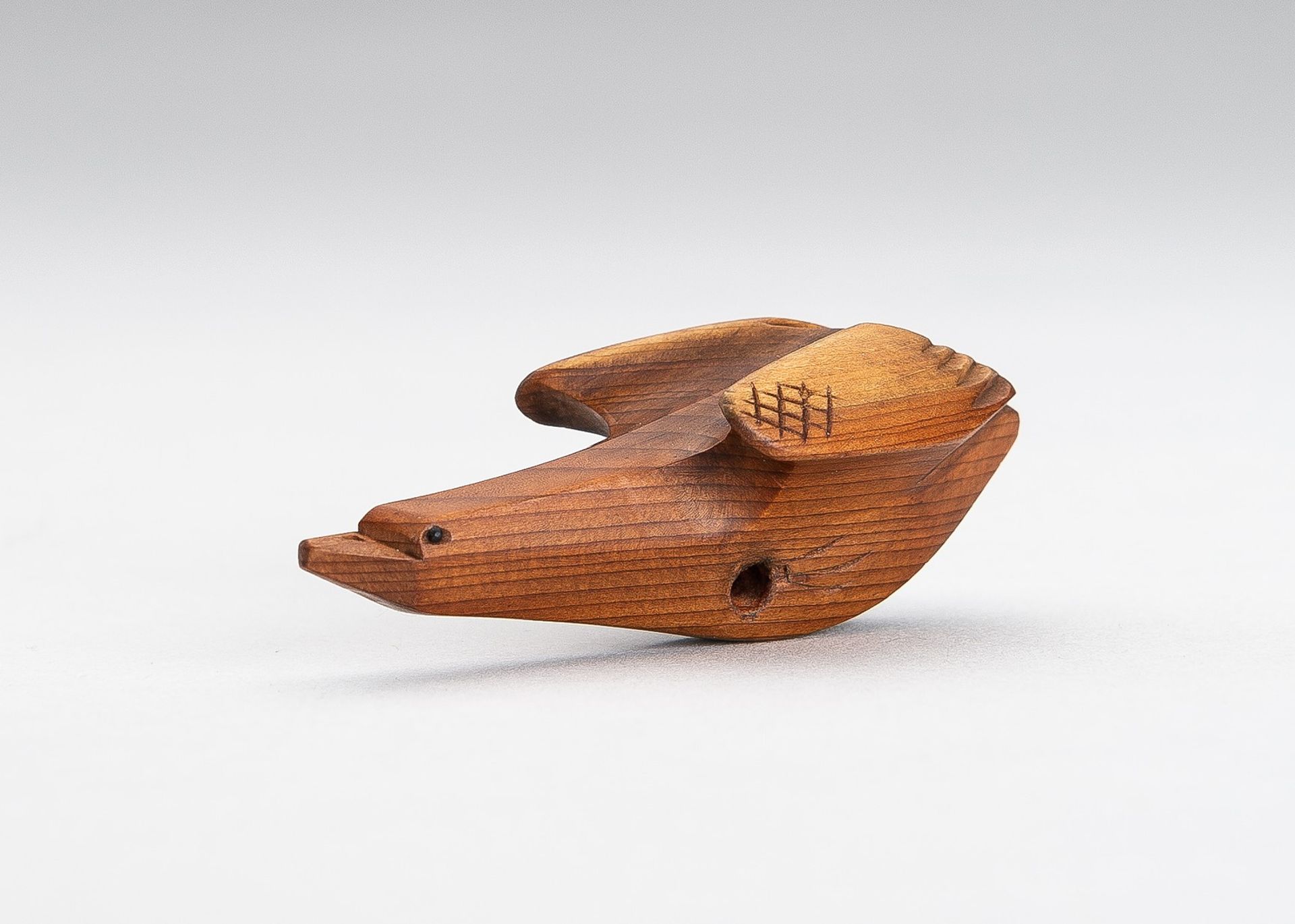 SUKETOMO: A HIDA SCHOOL ITTOBORI WOOD NETSUKE OF A BIRD