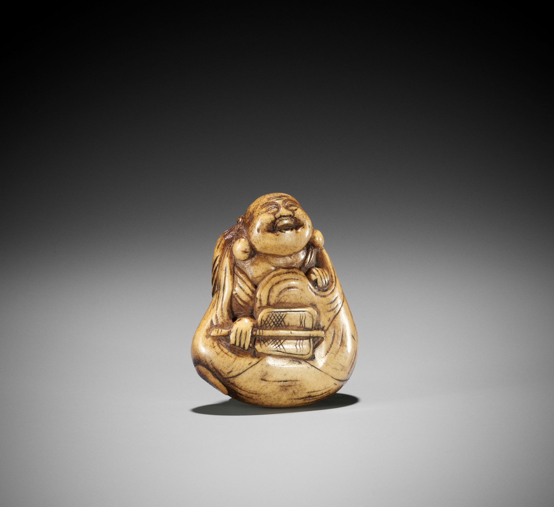 A LARGE STAG ANTLER NETSUKE OF HOTEI INSIDE HIS TREASURE BAG - Image 2 of 10