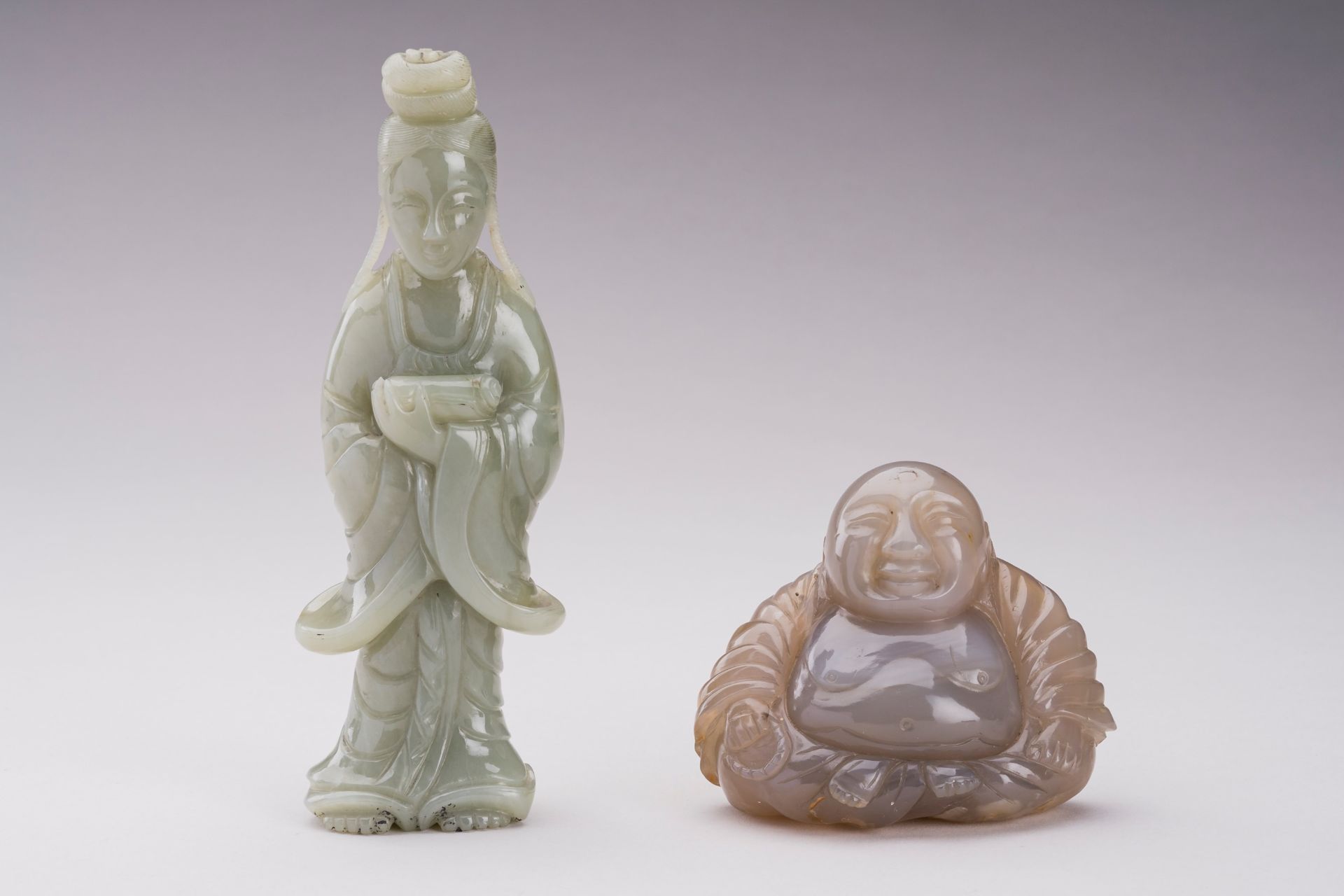 A GROUP OF TWO JADE & HARDSTONE FIGURES OF DEITIES