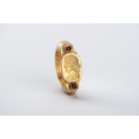 A BACTRIAN INTAGLIO SEAL GOLD RING