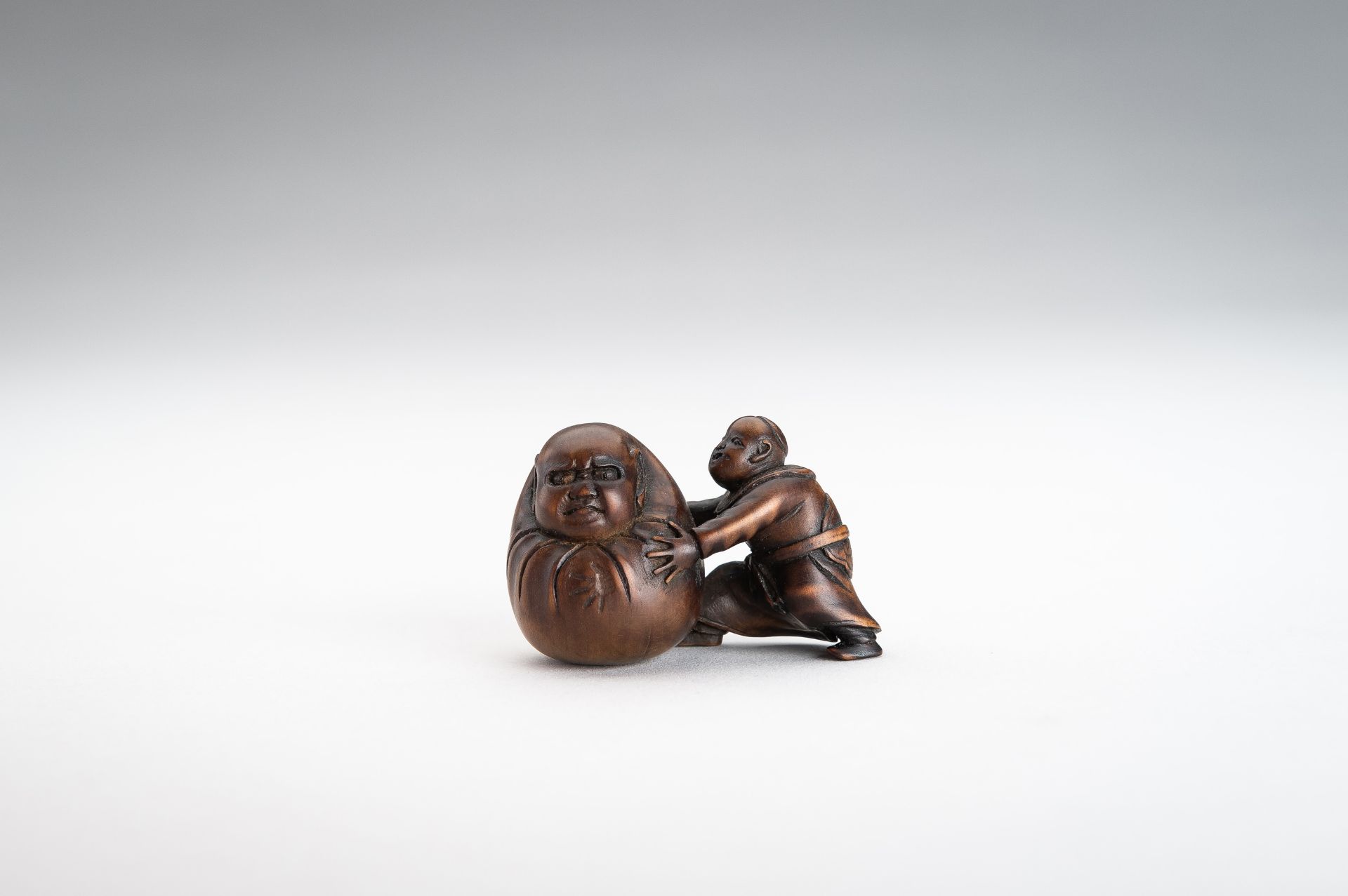 A WOOD NETSUKE OF A BOY WITH YUKI DARUMA (SNOWBALL) - Image 3 of 10