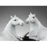 A PAIR OF WHITE-GLAZED FIGURES OF HORSES, QING DYNASTY