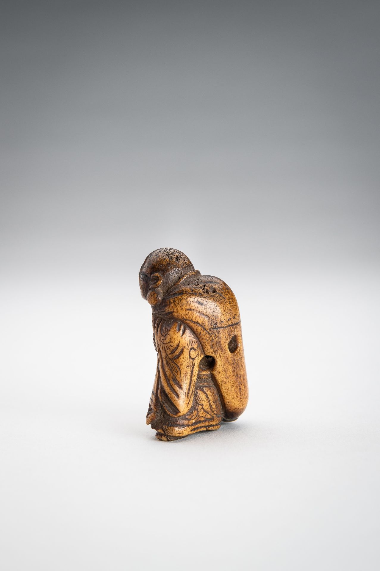 A STAG ANTLER NETSUKE OF HOTEI WITH HIS TREASURE BAG - Image 7 of 9