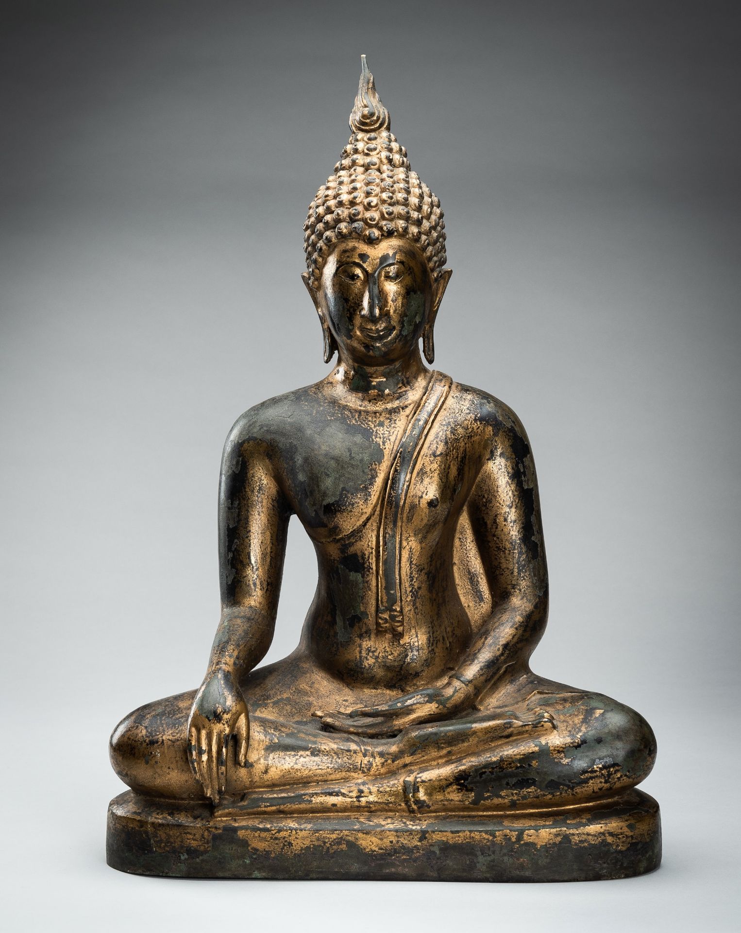 A LARGE LACQUER-GILT BRONZE FIGURE OF BUDDHA SHAKYAMUNI