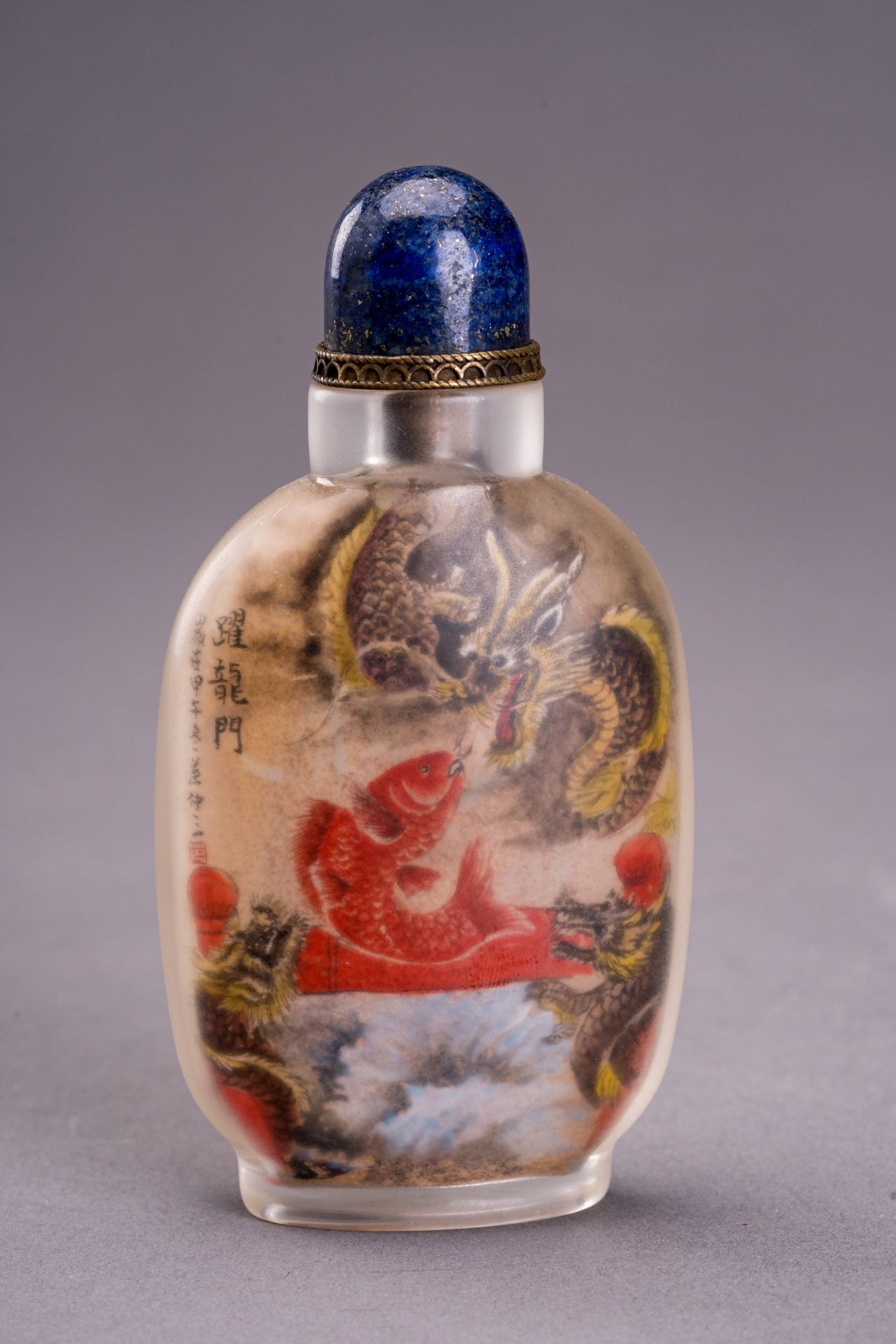 A LARGE INSIDE-PAINTED `DRAGONS AND CARP' GLASS SNUFFBOTTLE