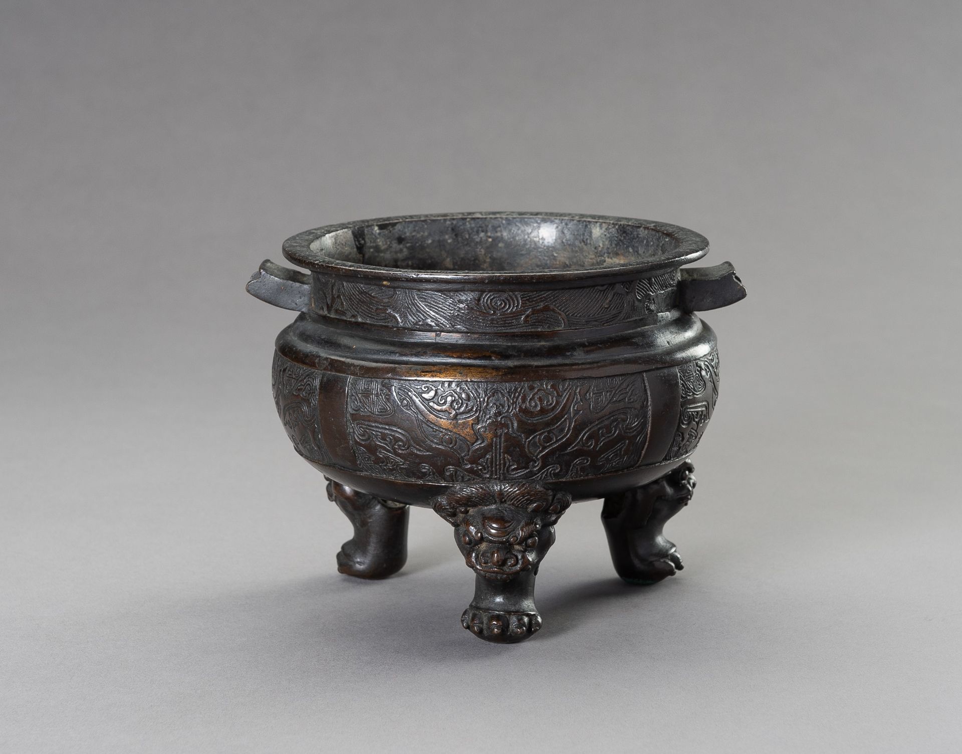 AN ARCHAISTIC MING-STYLE BRONZE TRIPOD CENSER