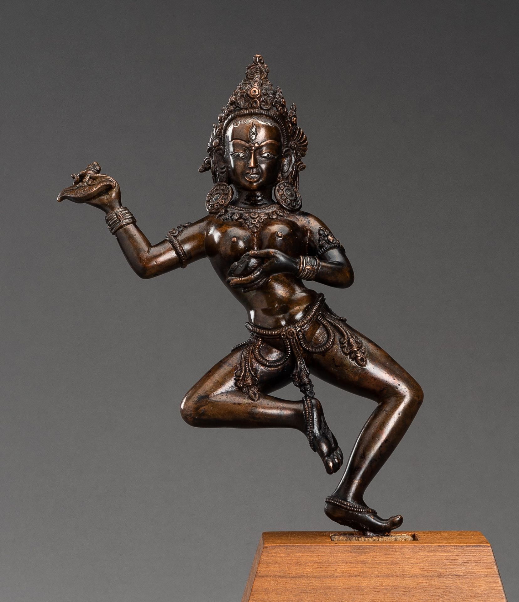 AN INLAID COPPER BRONZE FIGURE OF DAKINI AS VAJRAVARAHI