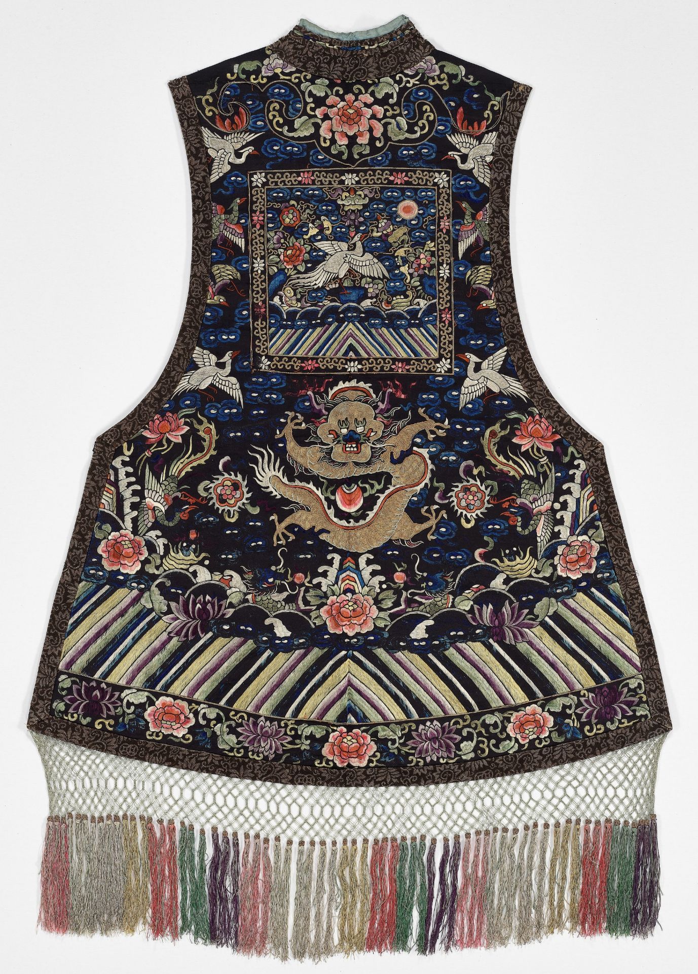 A SEMI-OFFICIAL EMBROIDERED SILK VEST AND RANK BADGE, LATE QING DYNASTY