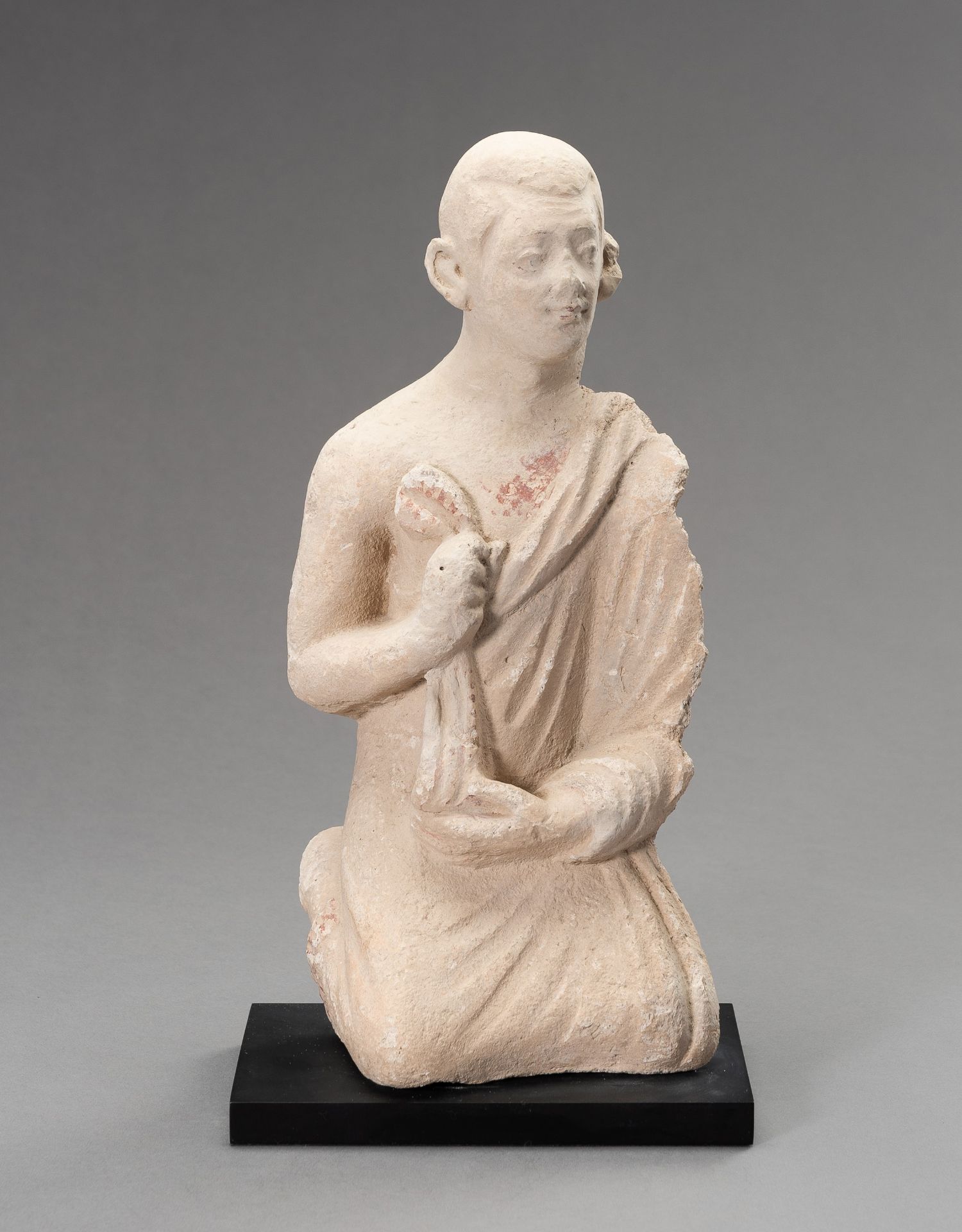 A STUCCO FIGURE OF A MONK, GANDHARA