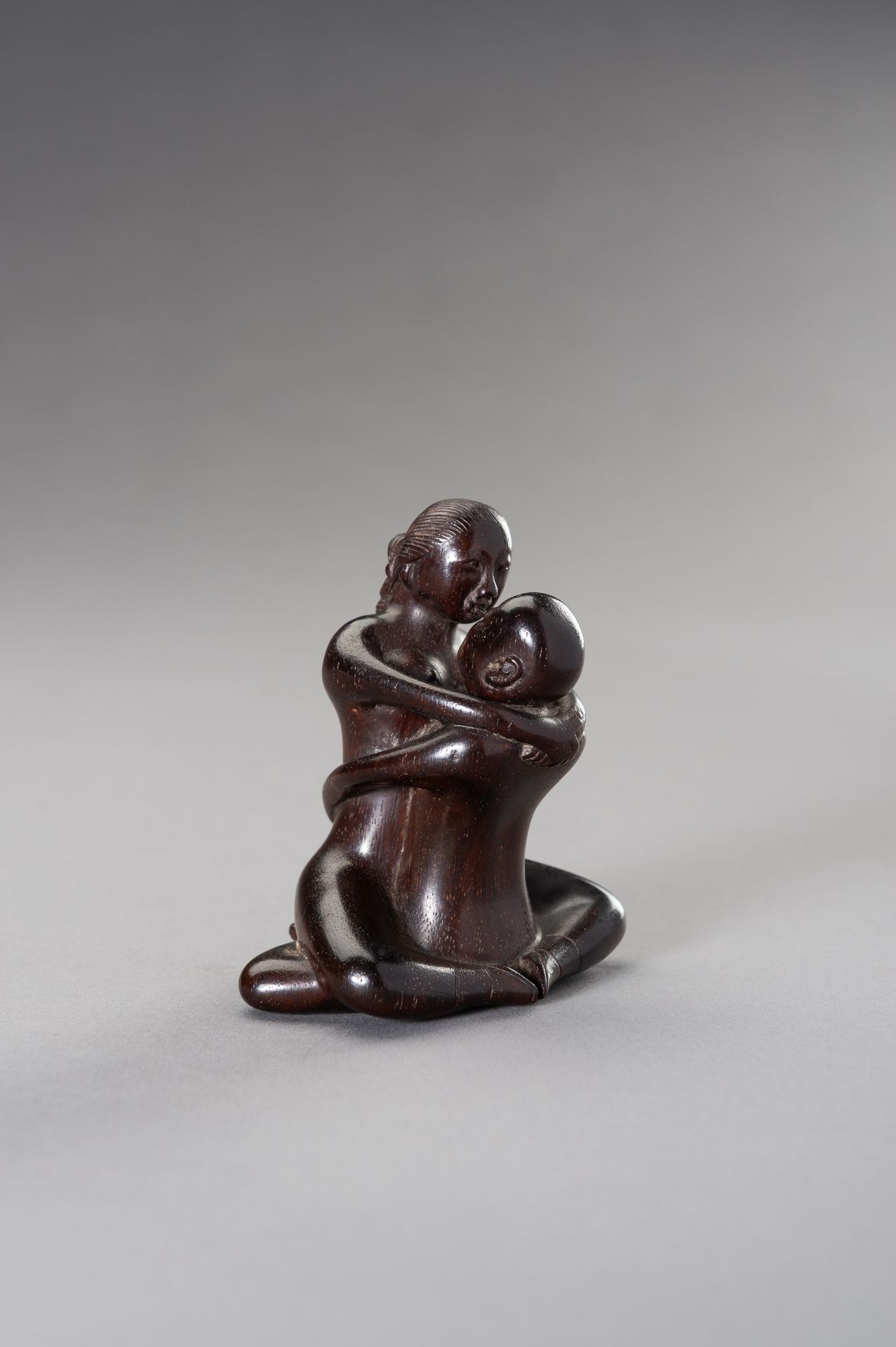 A ZITAN WOOD FIGURE OF A COUPLE IN EROTIC EMBRACE - Image 4 of 12