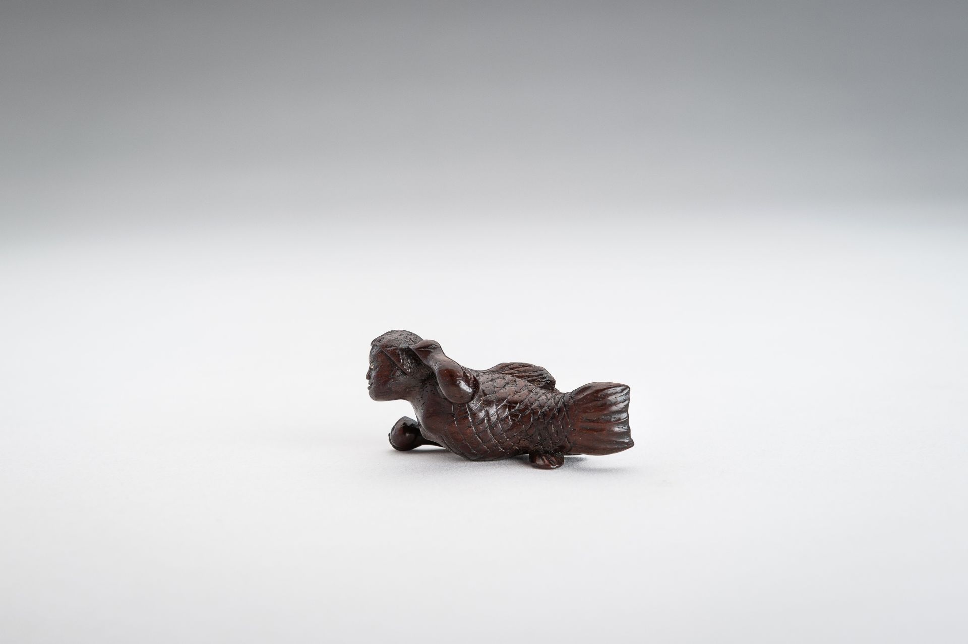 A WOOD NETSUKE OF A SWIMMING NINGYO (MERMAID) - Image 3 of 10