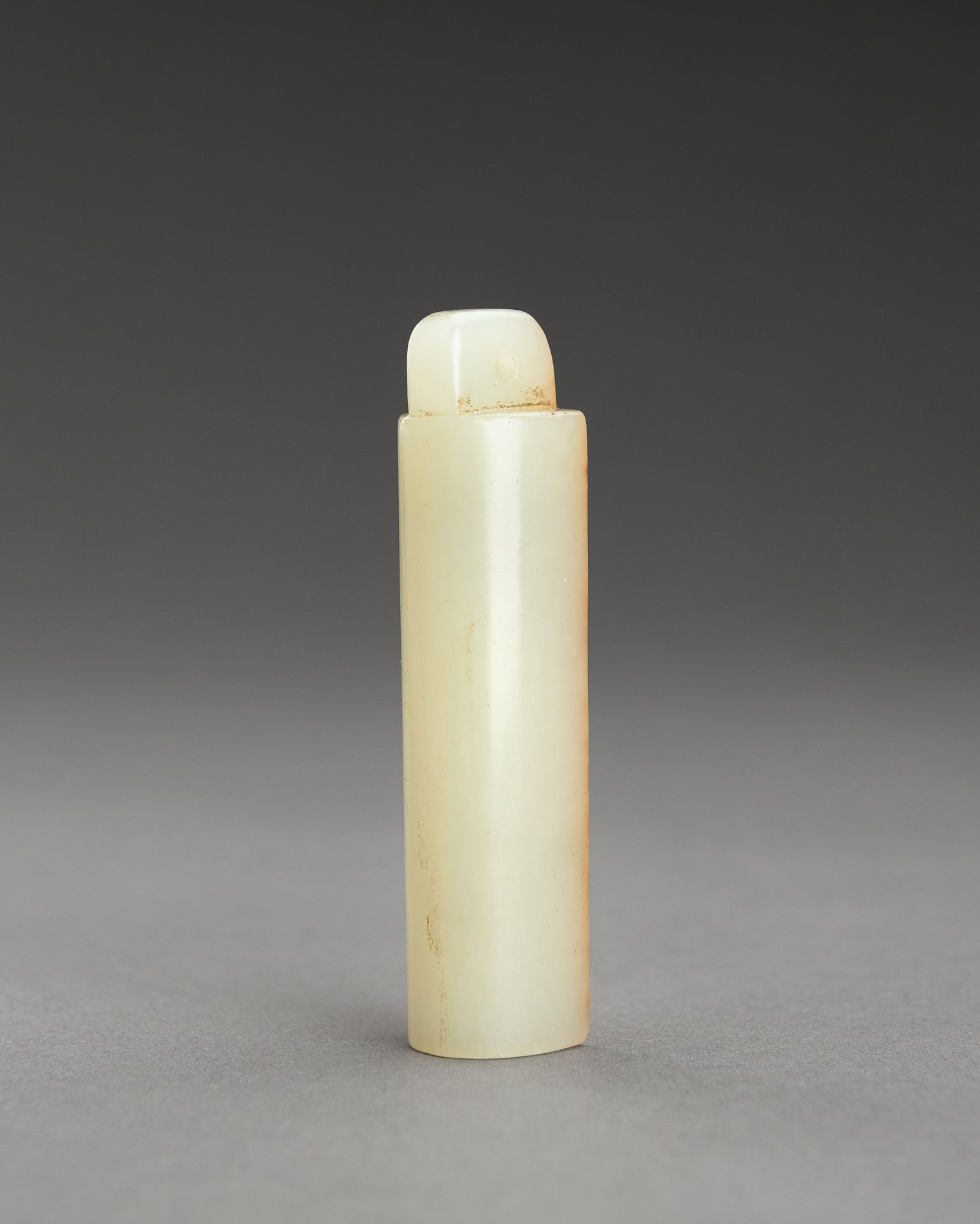 A PALE CELADON AND RUSSET JADE PLUME HOLDER