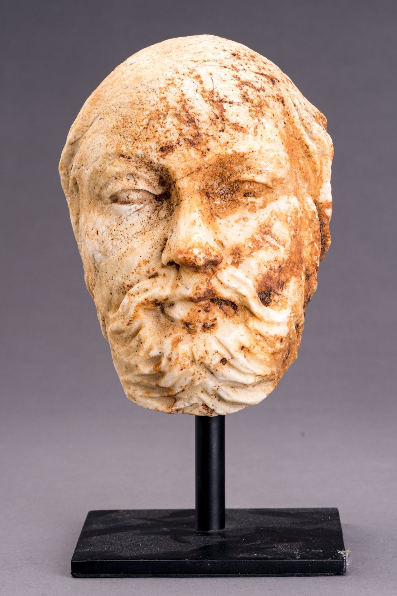 A GANDHARAN MARBLE HEAD OF A BEARDED MAN