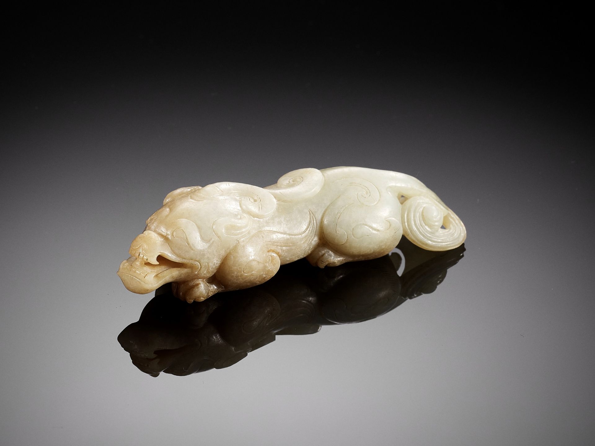 A JADE FIGURE OF A BIXIE, SIX DYNASTIES