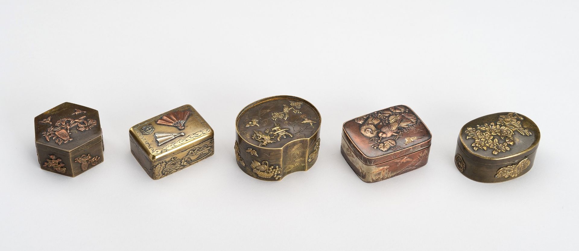 A LOT WITH FIVE SMALL METAL BOXES, MEIJI