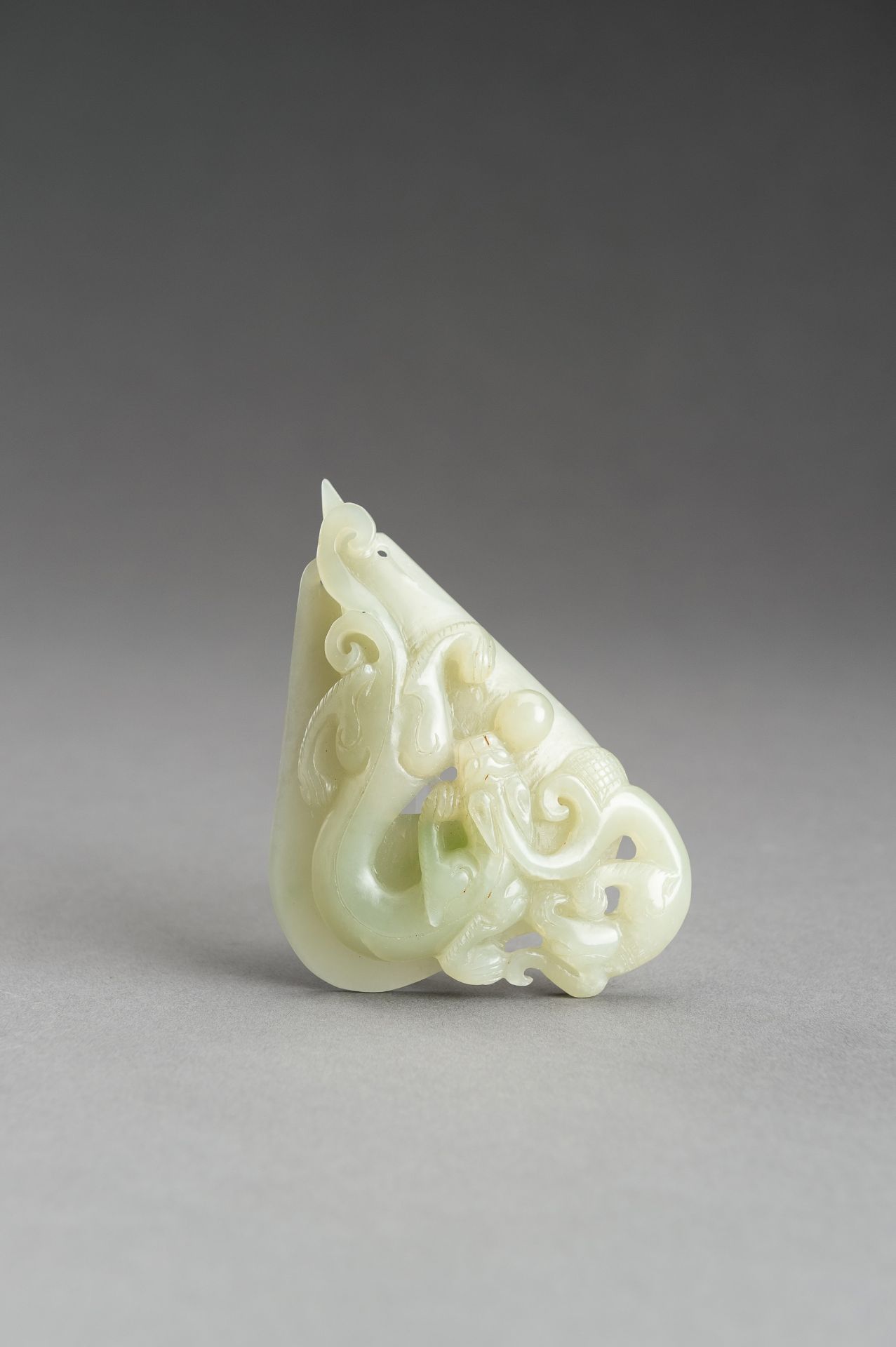 AN ARCHAISTIC PALE CELADON JADE PENDANT OF A CHILONG, 1920s - Image 11 of 14