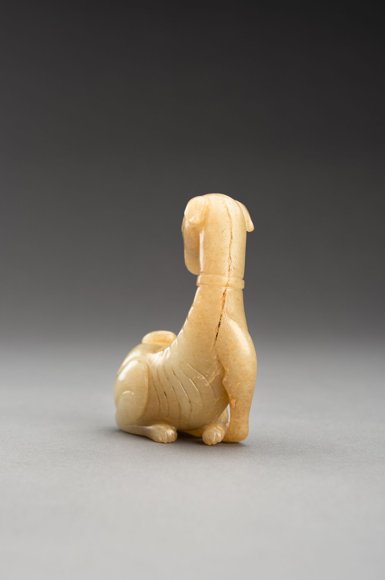 A PALE YELLOW JADE FIGURE OF A DOG, QING - Bild 7 aus 12