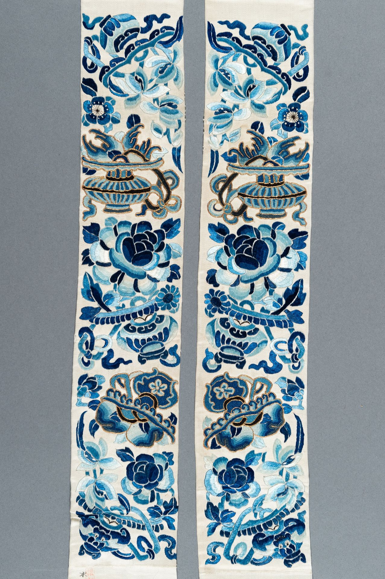 A PAIR OF 'AUSPICIOUS FLOWERS' SILK SLEEVE BANDS, QING