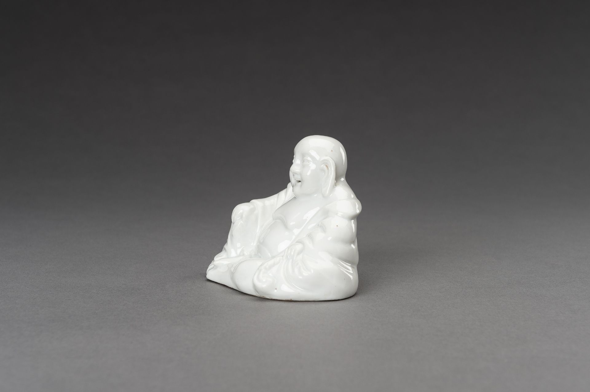 A BLANC DE CHINE PORCELAIN FIGURE OF BUDAI, c. 1920s - Image 4 of 11