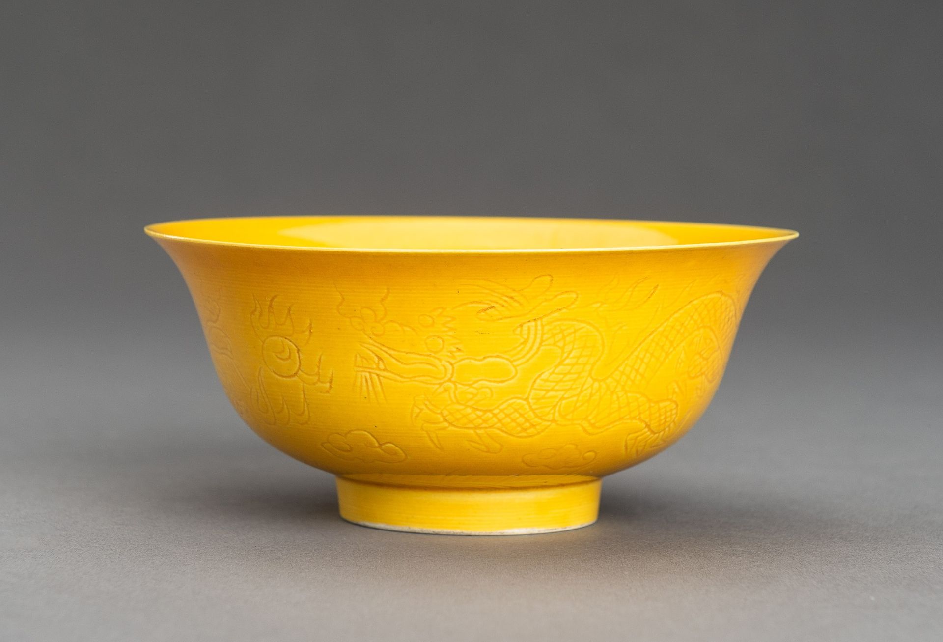 A YELLOW GLAZED 'DRAGONS' PORCELAIN BOWL, GUANGXU MARK AND PROBABLY OF THE PERIOD