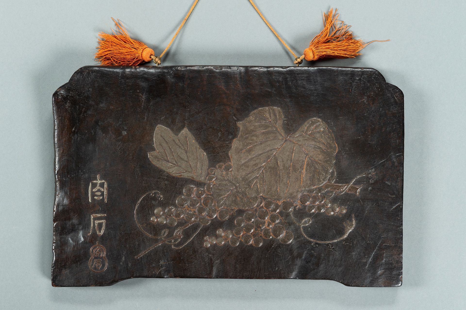 A CARVED WOODBLOCK WITH GRAPES, MEIJI