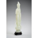 A PALE CELADON JADE CARVING OF A GUANYIN, 1900s
