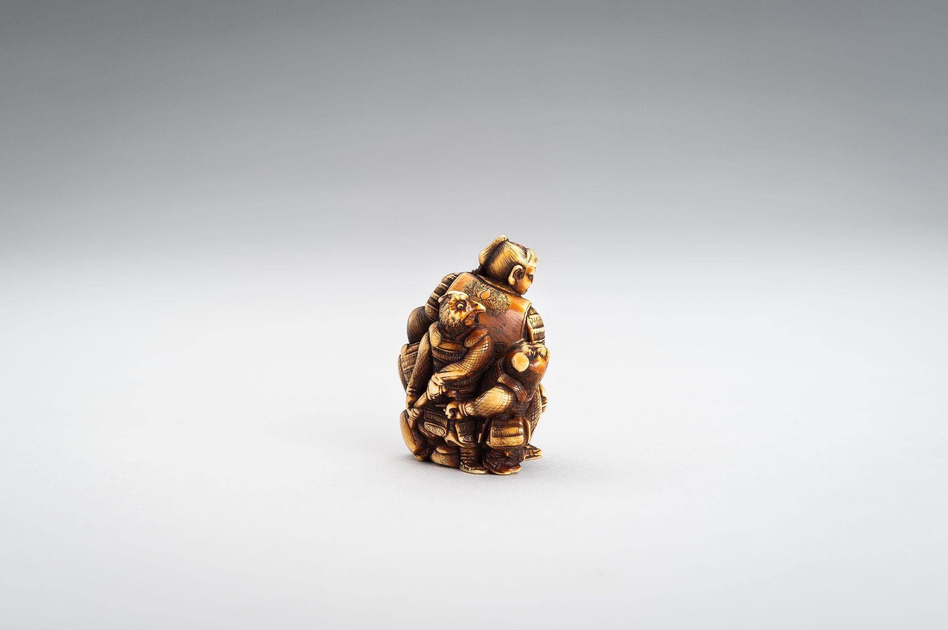 TOMOCHIKA: AN IVORY NETSUKE OF MOMOTARO WITH COMPANIONS - Image 4 of 11