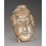 AN ARCHAISTIC GLASS MASK OF GUANYIN